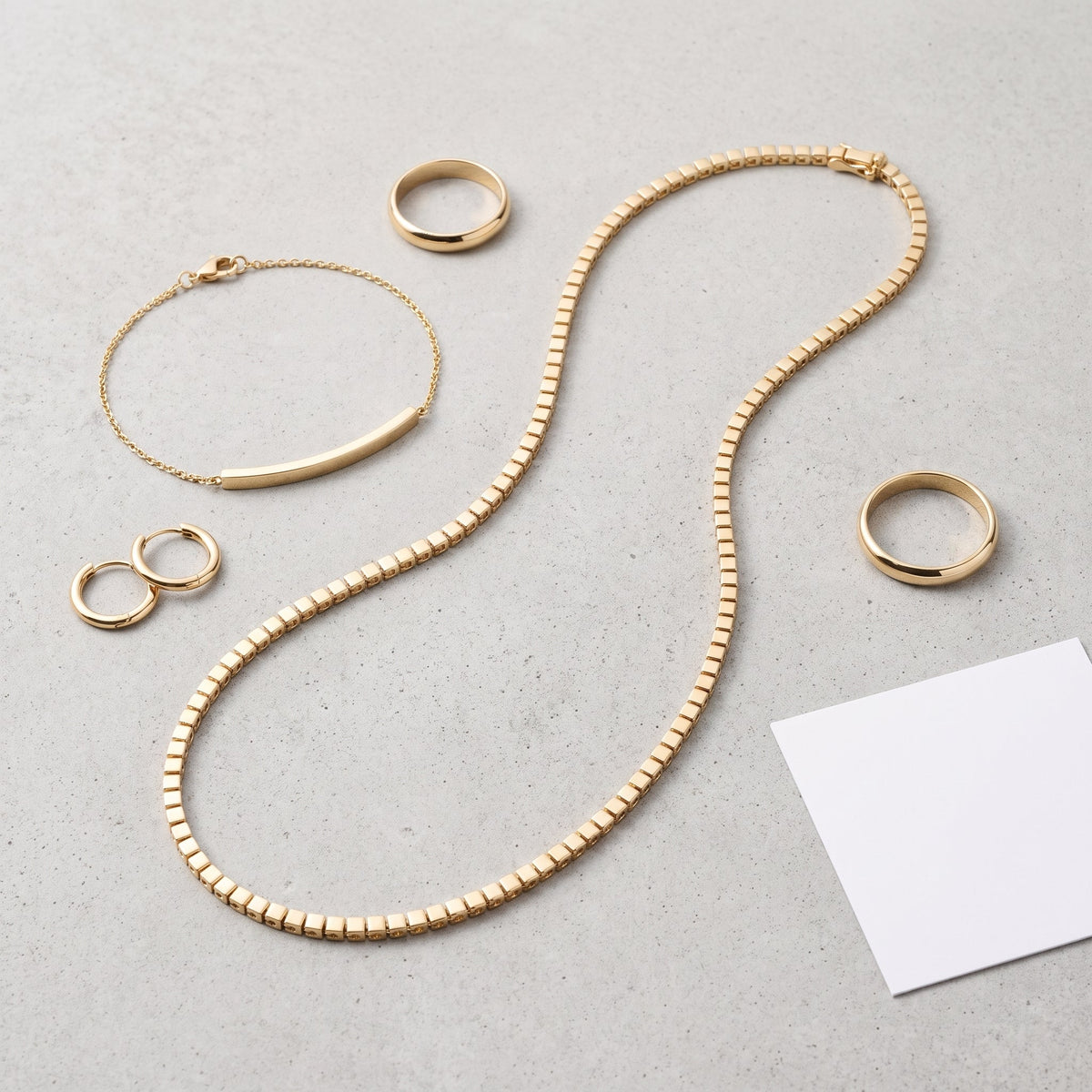 Collar tennis de circonitas bañado en oro de 18K combinado con otras joyas UpperEast
